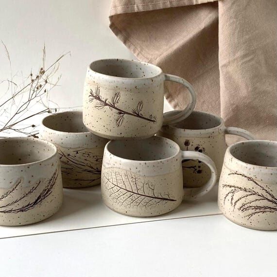 Cup with impressions of real plants: organic ...