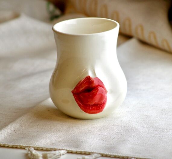 Hand made ceramic mugs with lips sculptures...