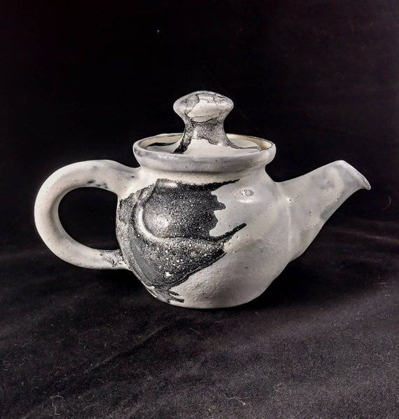 Handmade ceramic black and white teapot...