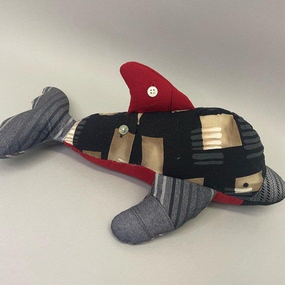 Memory keepsake dolphin made from baby grows ...