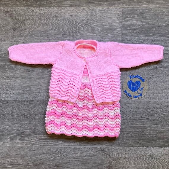 Hand knitted baby girls 2 piece pinafore & ca...