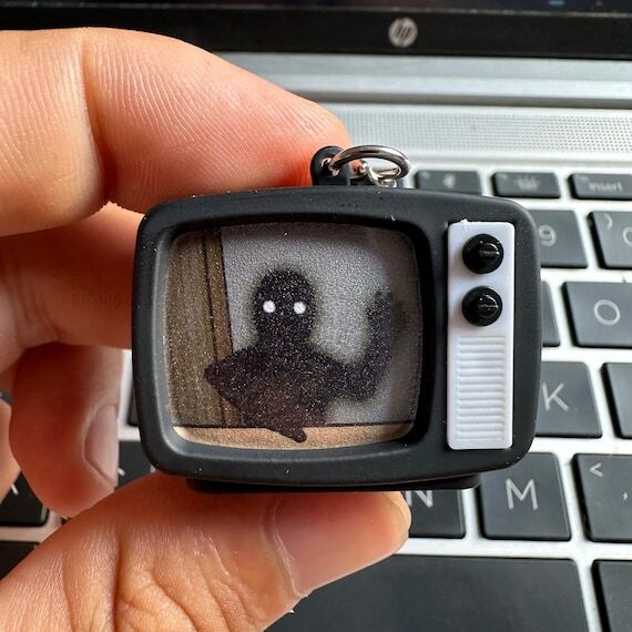Rusty Lake Hotel Mini TV Keychain with Static...