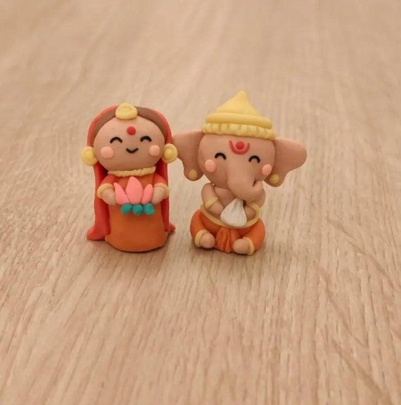 Orange Ganesh Laxmi Miniatures dolls, figures...