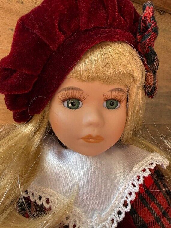 Vintage collectible porcelain doll in a Scott...