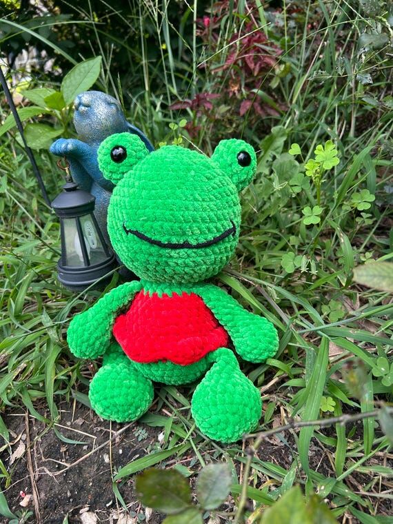 Handmade crochet green frog in red dress...