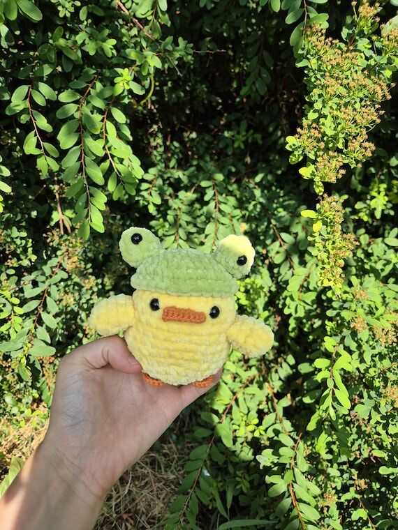 Handmade crochet duck plushies with frog hat...