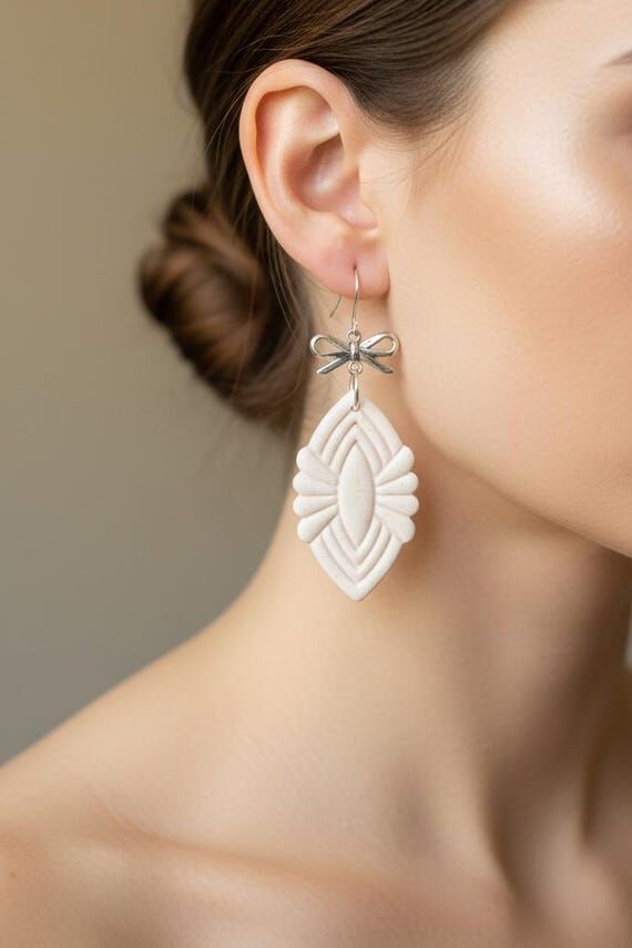 White Art Deco Silver Bow Dangle Earrings...