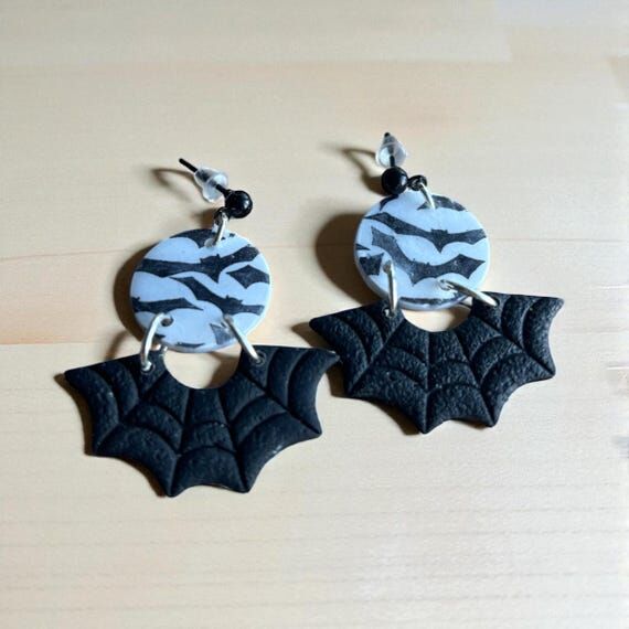 Spider web bat hypoallergenic dangle earrings...