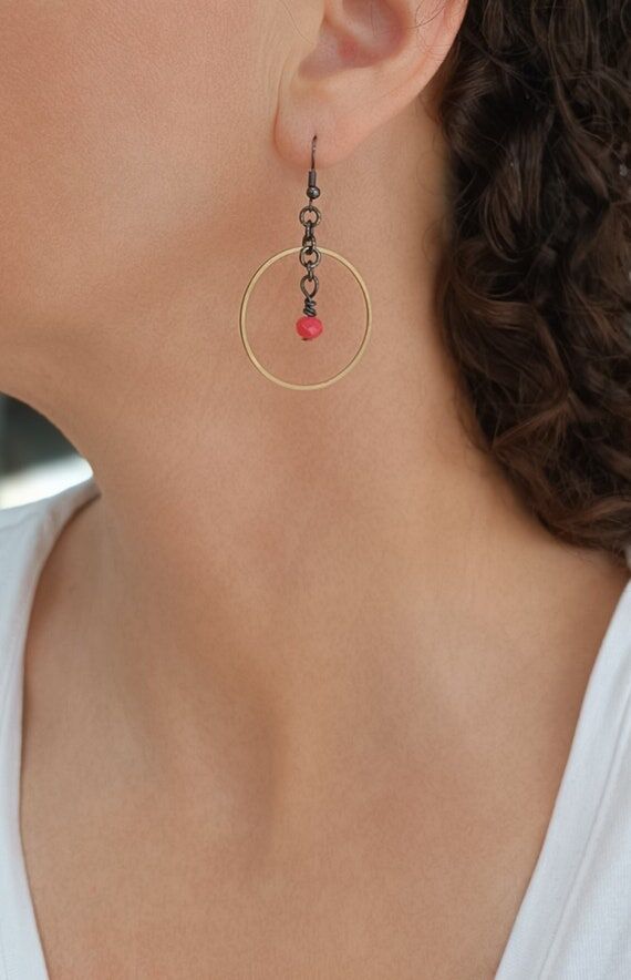 Coral glass bead on a gunmetal chain framed w...