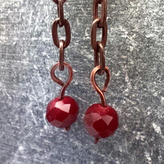 Silver earwire, copper chain and ruby crystal...