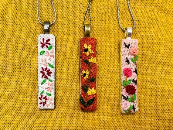 Hand embroidered floral pendants....