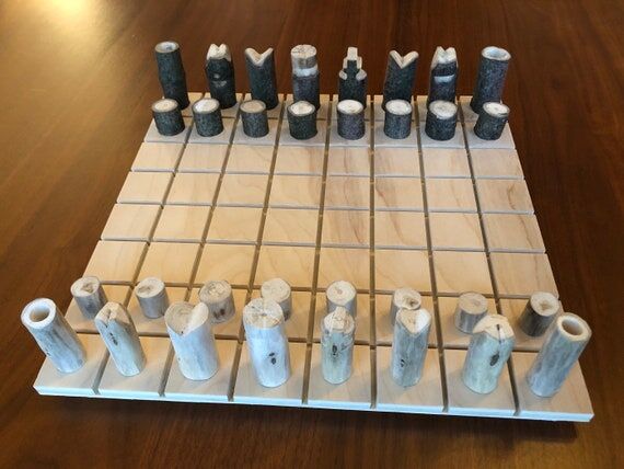 Hand-carved wooden chess set with 11x11” bo...