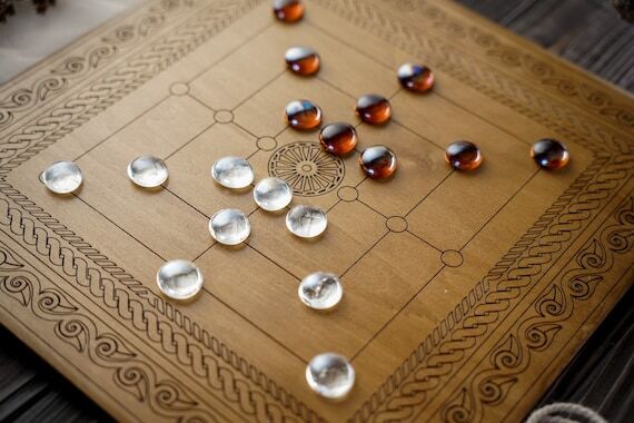 Nine men Morris strategy board game, cowboy c...