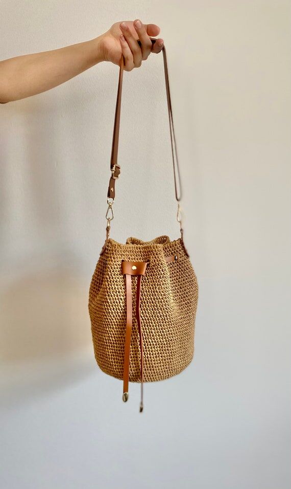 Handwoven Raffia Bucket Bag: Vegan Leather St...