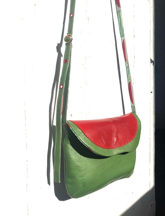 GOLDFINGER is a handmade recycled leather pur...