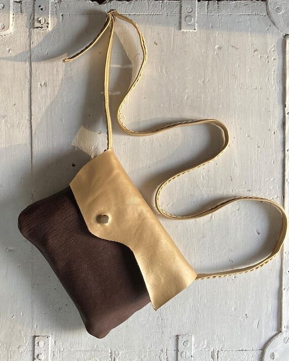 GOLD TAN is a handmade shoulder bag in gold a...
