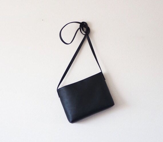 Minimalist black leather crossbody bag with m...