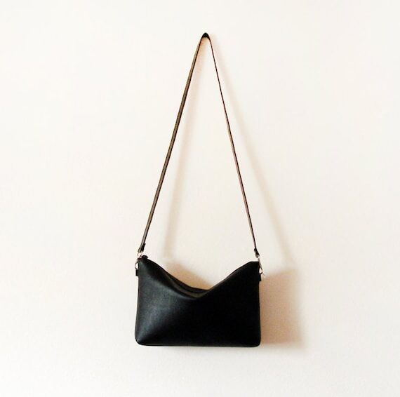 Simple black leather crossbody bag with zippe...