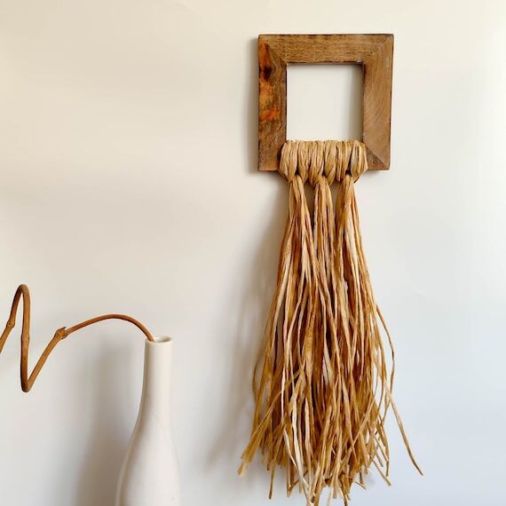 Decorative wall hanging with wooden hollow sq...
