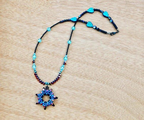 Turquoise blue and black beaded handmade dagg...