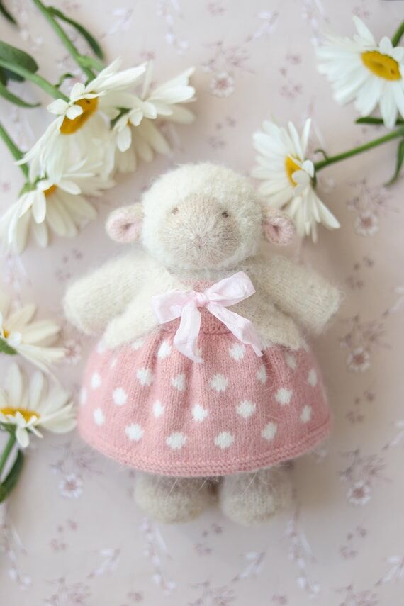 Knitted plush lamb doll in a cute pink dress ...