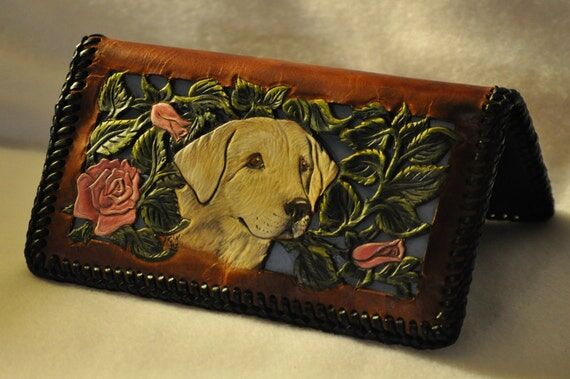 Handcarved leather filigreed checkbook cover...