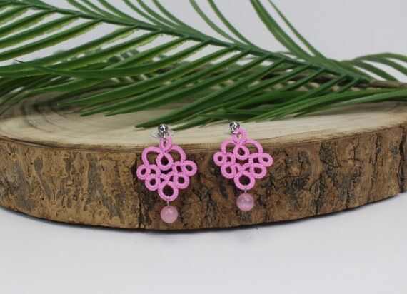 Earrings made of pink tatted lace and cat eye...