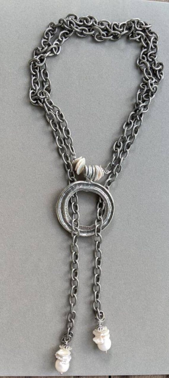 Large silver ring with keshi pearls is the ce...