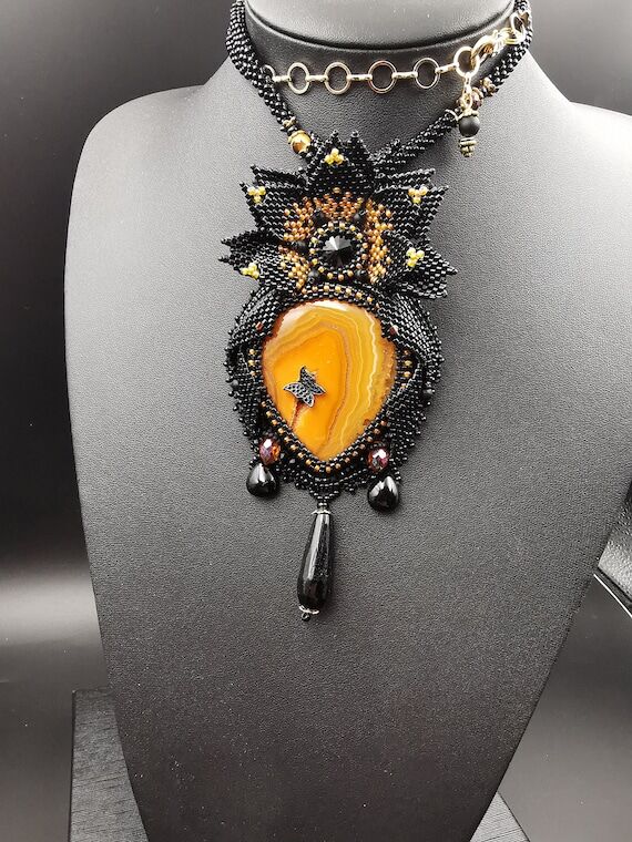 Handmade pendant with orange agate and a larg...