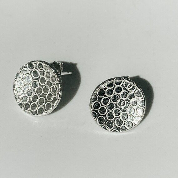 Round handmade earrings with texture...