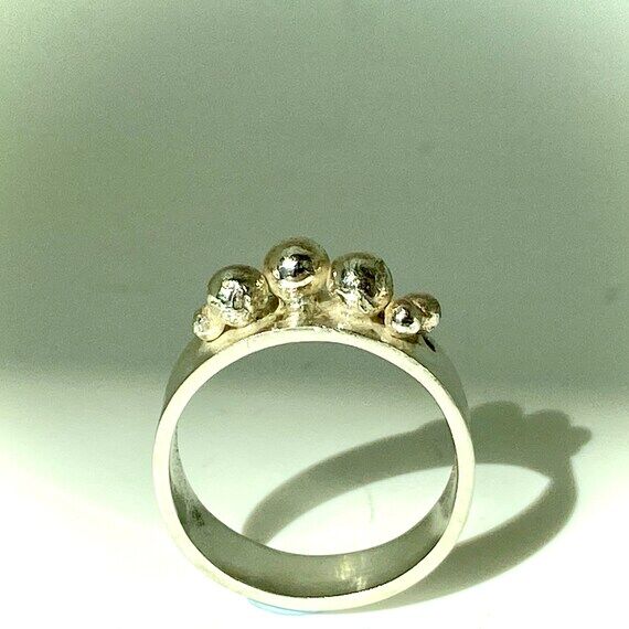 Statement handmade ring inspired by stone cai...