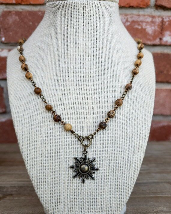 Beaded Boho Bronze Colored Sun Charm Necklace...