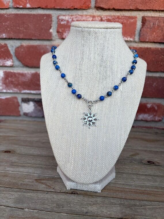 Beaded Boho Silver Colored Sun Charm Necklace...