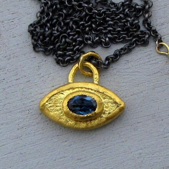 Blue Topaz & 24k Gold Eye Pendant Necklace...