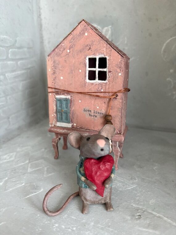 Handmade paper mache mouse in a house, miniat...