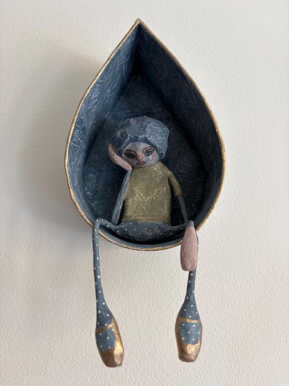Sad girl in teardrop paper mache wall art...