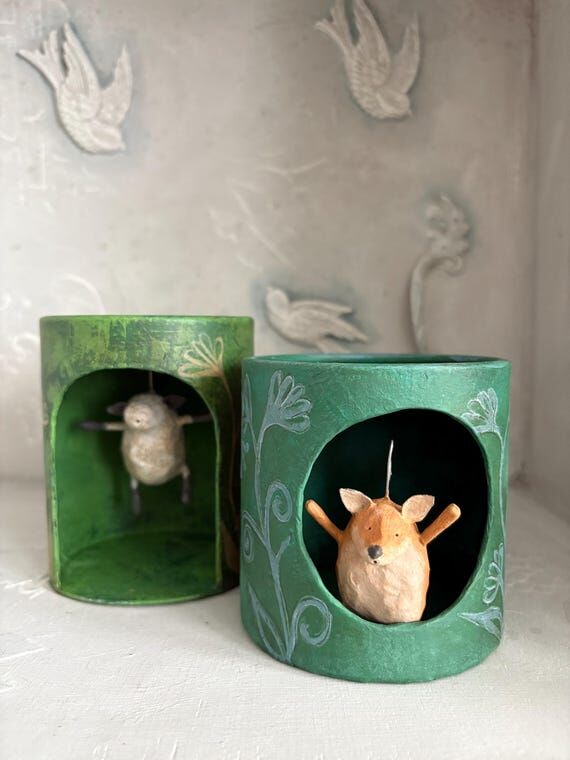 Handmade paper mache tube diorama with dangli...