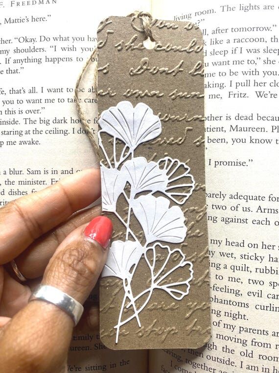Ginkgo Biloba on Brown Cursive Writing Emboss...