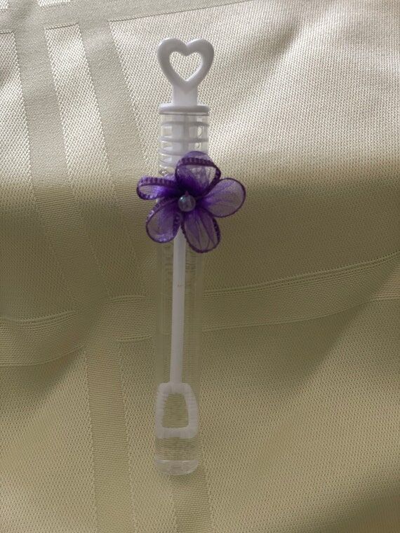 Bubbles in clear tube decorated with a purple...