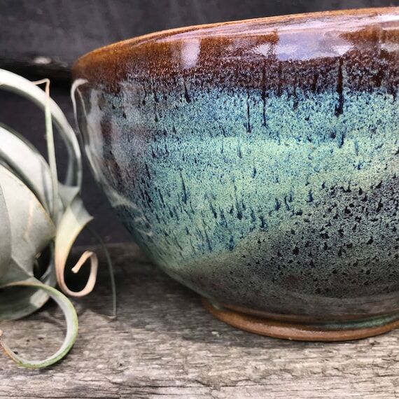 Pottery fruit bowl in turquoise green...