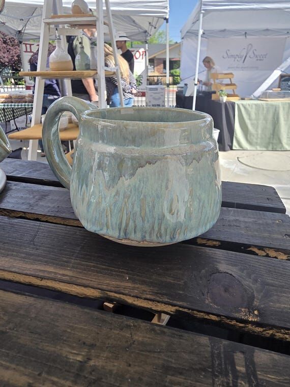 Pottery Mugs in multi colored glaze...