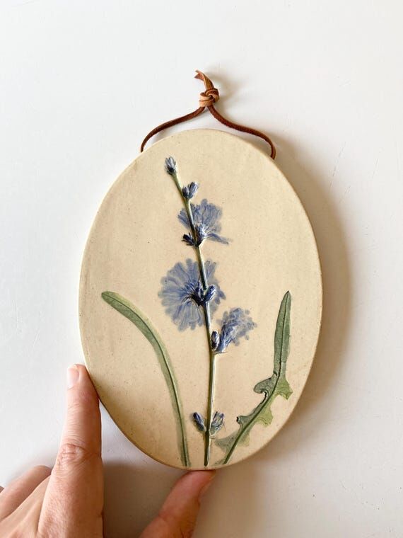 Botanical ceramic wall hanging with hand pain...