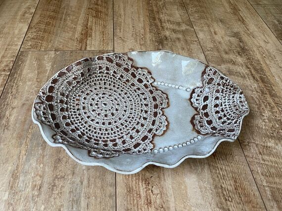 Handmade ceramic pottery white bowl with brow...
