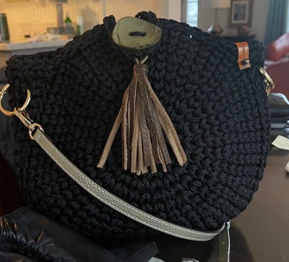 Black Charmer Crochet Handbag...