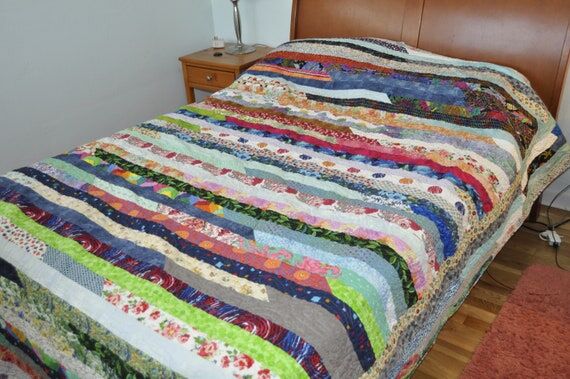 A handmade scrappy queen quilt...