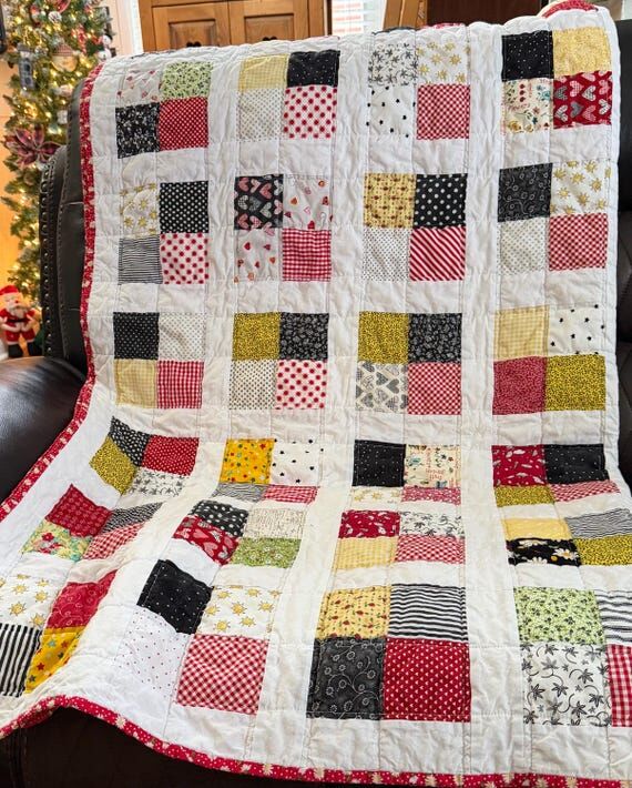 Handmade scrappy cotton lap quilt (55x63)....