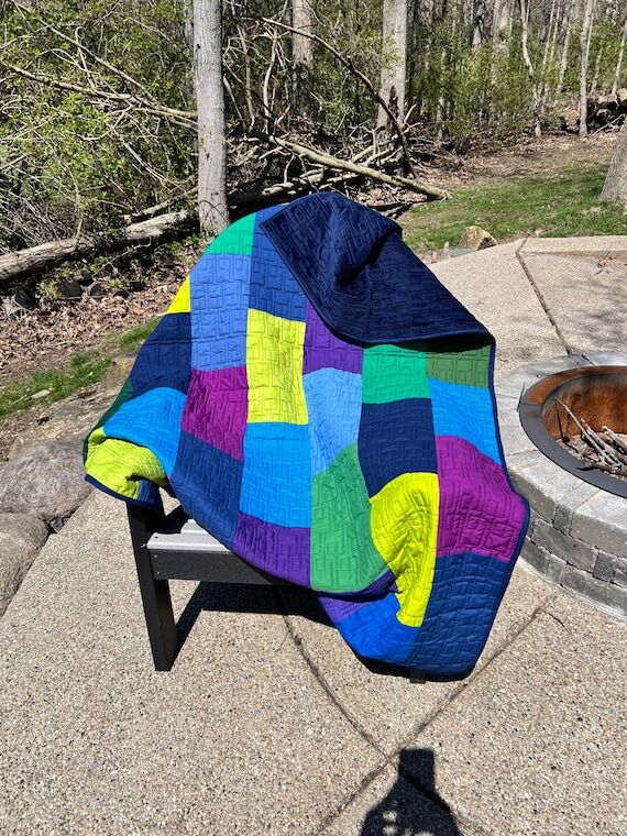 Modern Handmade Quilt in dark colors using bl...