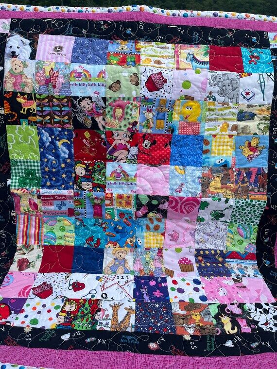Handmade scrappy child’s quilt 39 inches by...