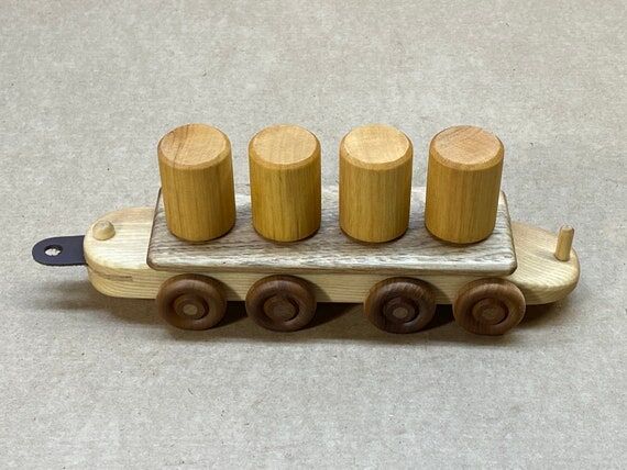 Toy train car shape sorting can car, made of...