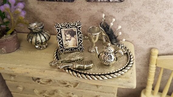 Set of lady's accessories on a silver tray an...